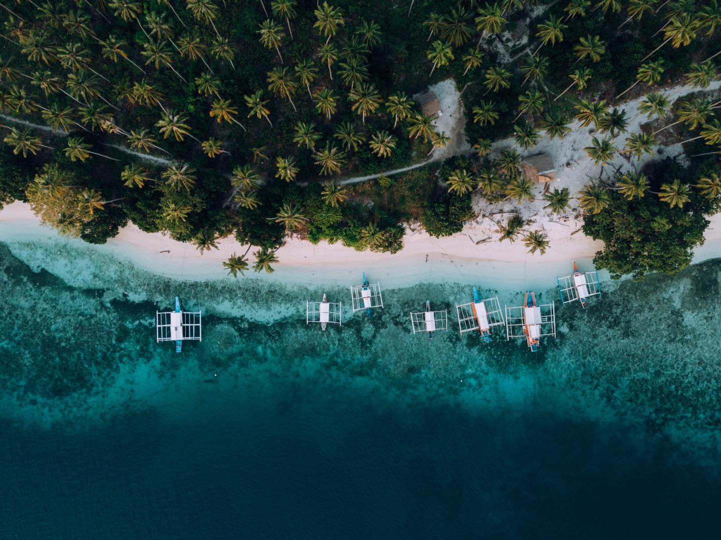 Aerial drone view of Balabac's turquoise lagoon at Kamp Malaya