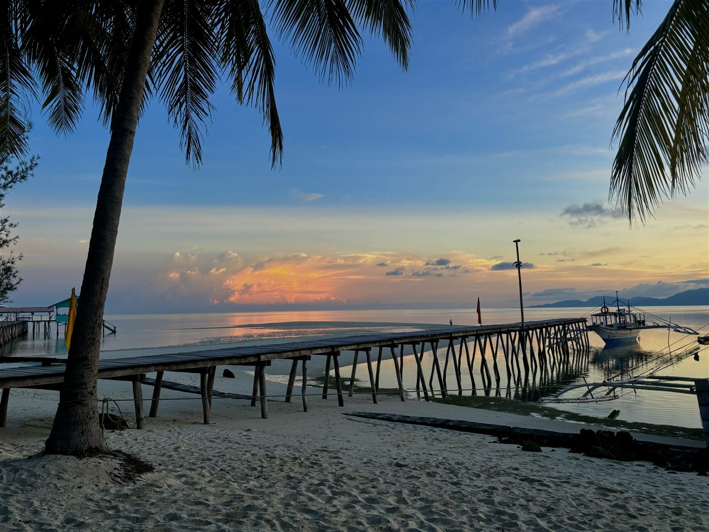 Onok Island at sunset, a sandbar reaching into calm water
