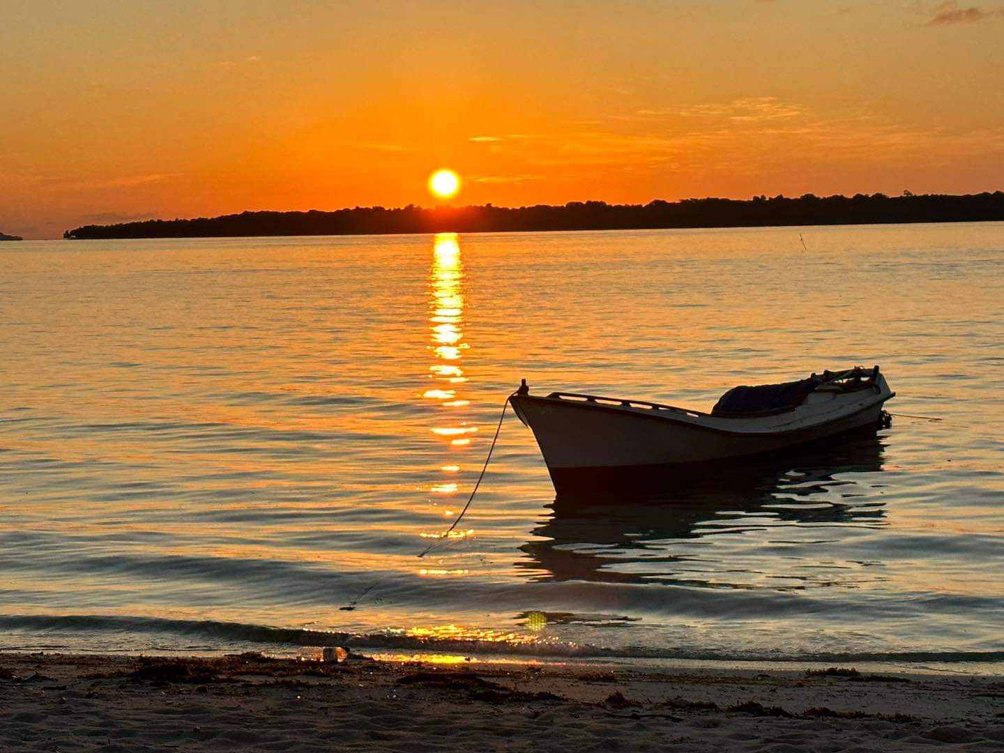 Sunset Drift — golden sunset over calm Balabac waters